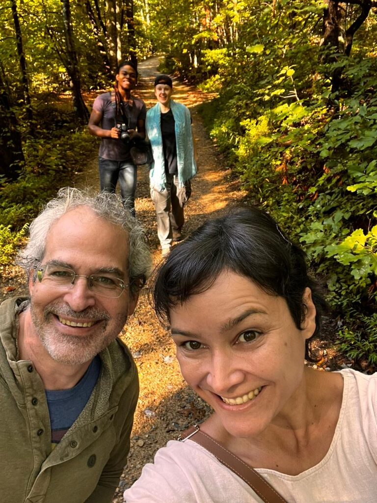 Daniel and Bianca on a trail in the woods