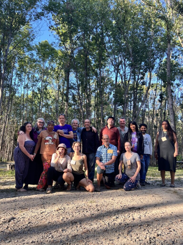 A large group of people posing for a photo at the Convergence for Intentional Communities